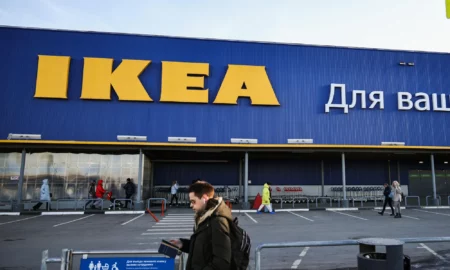 photo-of-a-man-walking-in-front-of-ikea-store