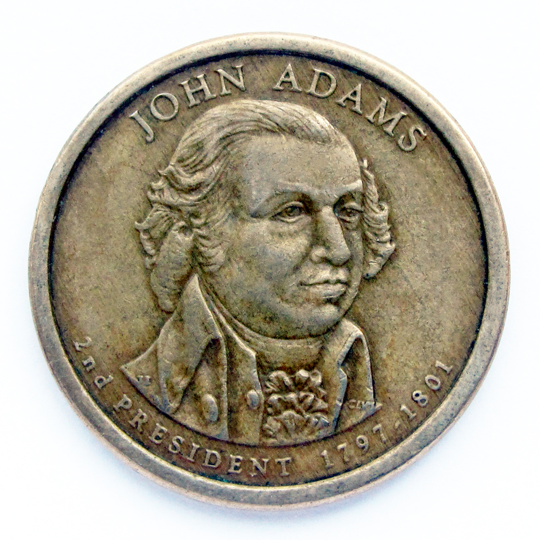 Monedă veche de 1 dolar din Statele Unite. Moneda prezintă un portret al lui John Adams, al doilea președinte al SUA, unul dintre părinții fondatori ai Statelor Unite. (sursă foto: dreamstime.com)